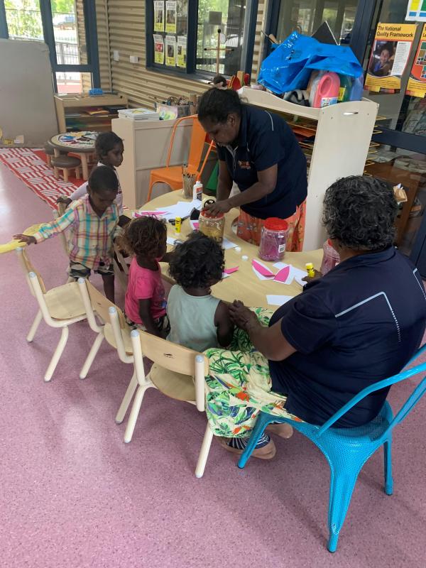 Creche staff crafting with the kids