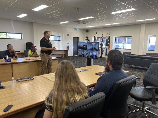 CEO talking to screen with other staff