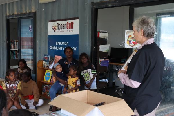 Vet Nurse Kay showing children the book