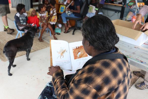 Delma reading the book for the first time