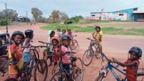 Kids riding bikes in a remote community